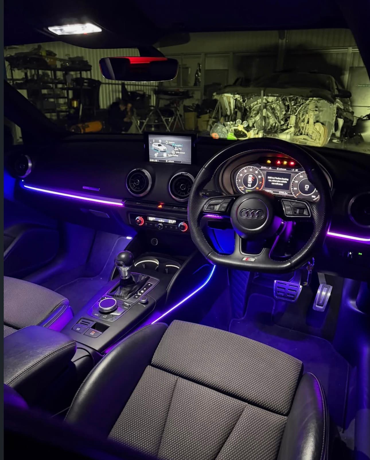Audi cabin lit in purple ambient light